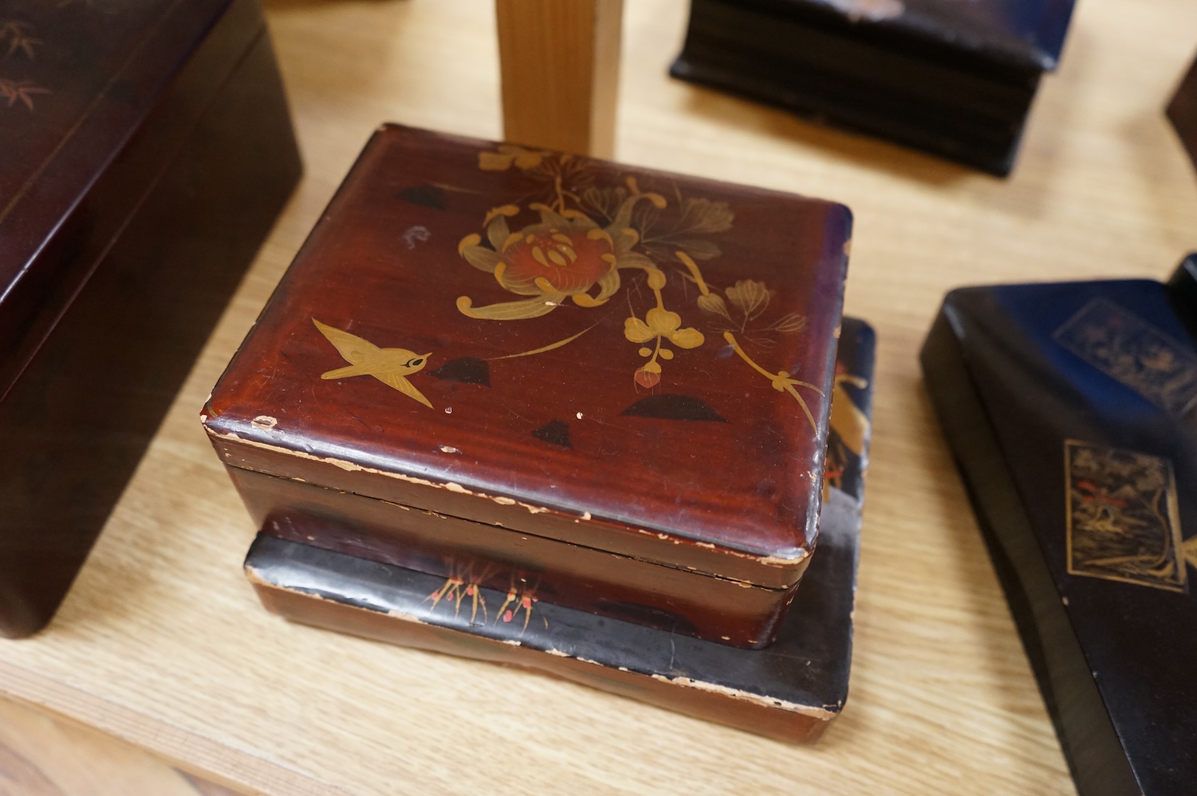 A group of 19th/20th century Japanese lacquer boxes and a similar tabletop cabinet, the latter 31cm wide